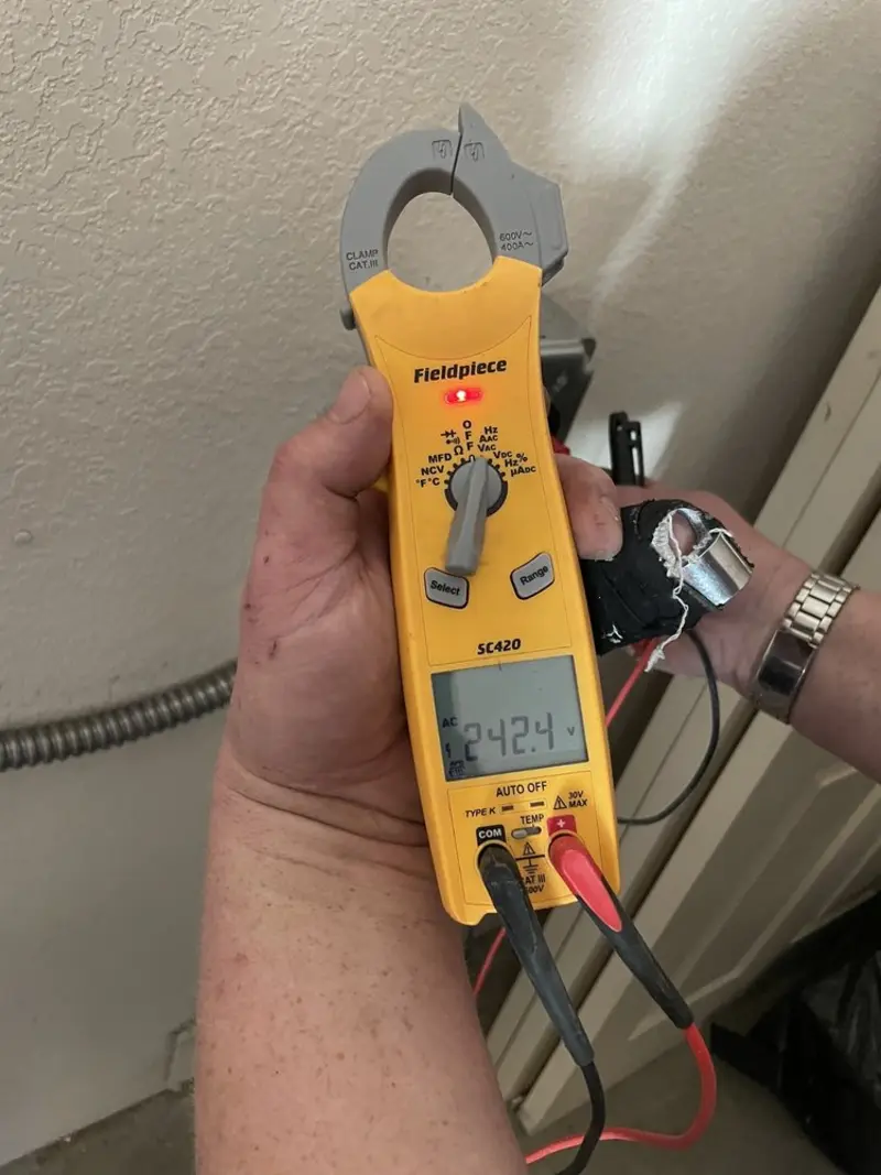 Voltage testing with clamp meter during Outlet Installation in New Baden
